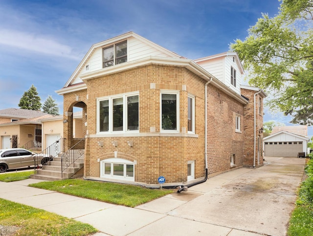2435 Davisson St, River Grove, IL 60171 - view of front facade with brick siding, an outdoor structure, and a garage