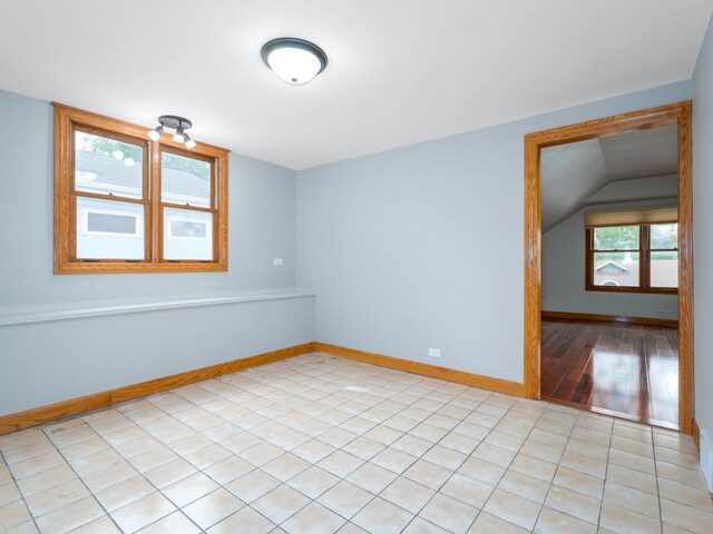 2435 Davisson St, River Grove, IL 60171 - unfurnished room with baseboards and vaulted ceiling