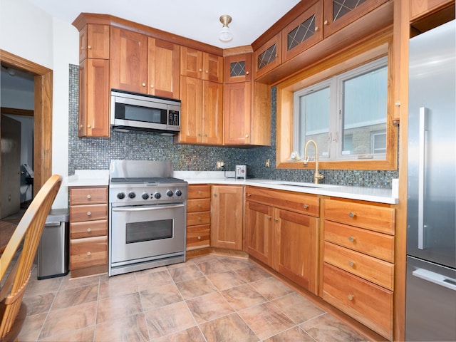 2435 Davisson St, River Grove, IL 60171 - kitchen featuring stainless steel appliances, light countertops, tasteful backsplash, and brown cabinetry
