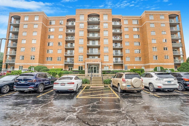 6807 N Milwaukee Ave Unit 411, Niles, IL 60714 - view of apartment building / complex with uncovered parking
