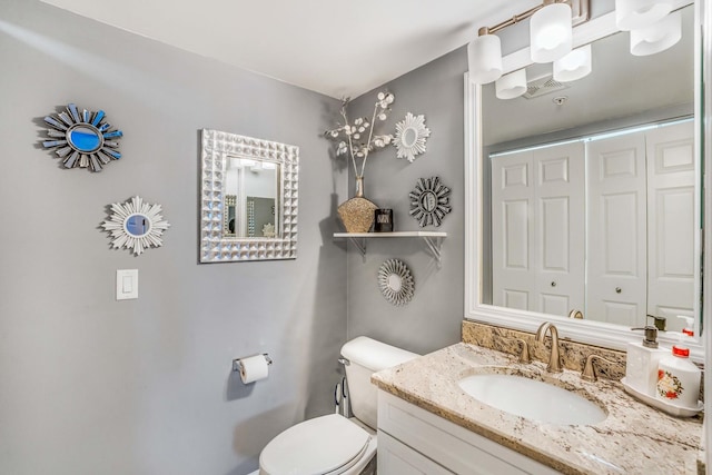 6807 N Milwaukee Ave Unit 411, Niles, IL 60714 - bathroom featuring toilet and vanity