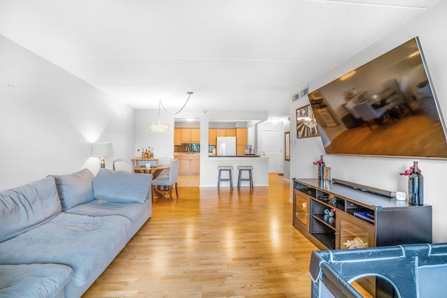 6807 N Milwaukee Ave Unit 411, Niles, IL 60714 - living area featuring light wood-style flooring