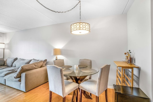 6807 N Milwaukee Ave Unit 411, Niles, IL 60714 - dining space featuring light wood-type flooring