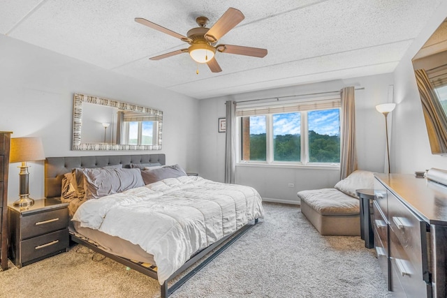 6807 N Milwaukee Ave Unit 411, Niles, IL 60714 - bedroom with light colored carpet, multiple windows, a textured ceiling, and a ceiling fan