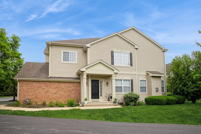 6073 Canterbury Ln Unit 33-5, Hoffman Estates, IL 60192 - traditional home with a front yard, brick siding, and a shingled roof