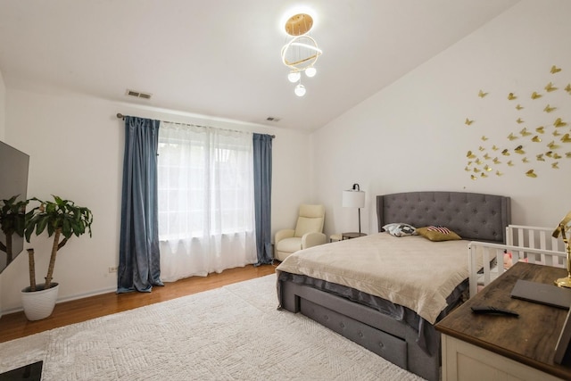6073 Canterbury Ln Unit 33-5, Hoffman Estates, IL 60192 - bedroom with light wood-type flooring and lofted ceiling