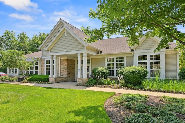 1845 Avon Dr, Hoffman Estates, IL 60192 - craftsman inspired home featuring a front lawn, a shingled roof, and stone siding