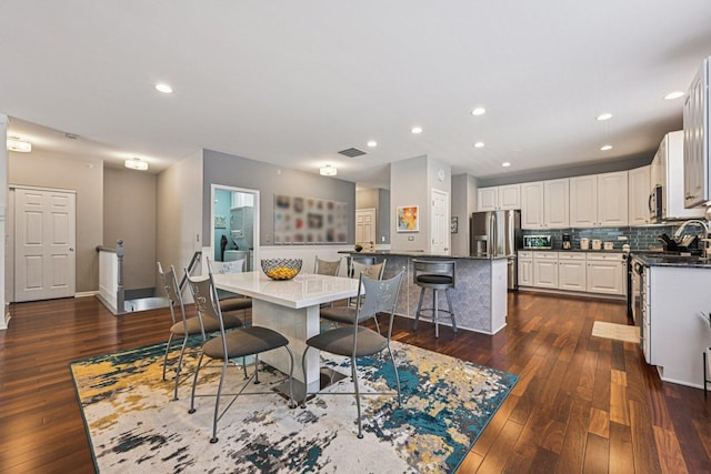 1845 Avon Dr, Hoffman Estates, IL 60192 - dining space with dark wood finished floors and recessed lighting
