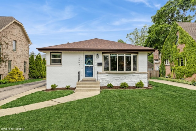 127 Elm St, Glenview, IL 60025 - bungalow featuring a shingled roof and brick siding