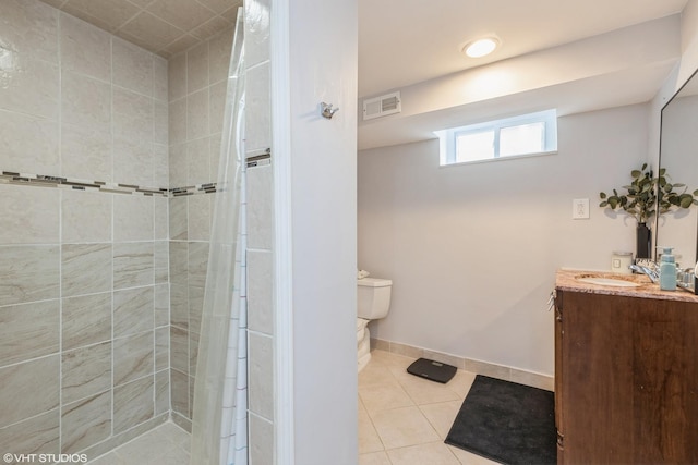 127 Elm St, Glenview, IL 60025 - bathroom featuring vanity, tile patterned flooring, and a tile shower