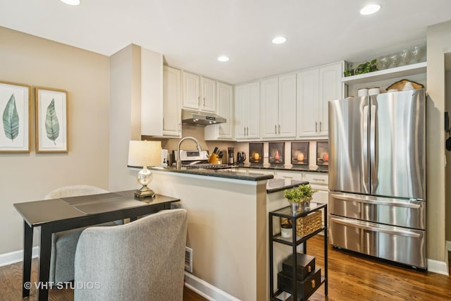 884 Bristol Dr Unit 0, Barrington, IL 60010 - kitchen with freestanding refrigerator, under cabinet range hood, a peninsula, a breakfast bar, and white cabinetry