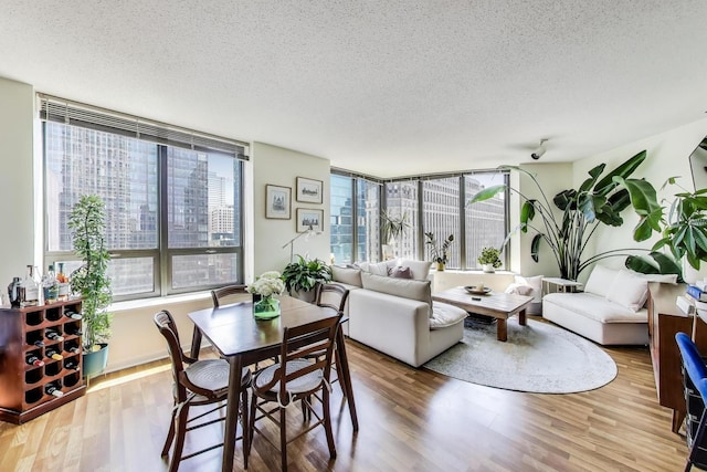 400 N La Salle Dr Unit 1607, Chicago, IL 60654 - dining area with a textured ceiling and wood finished floors