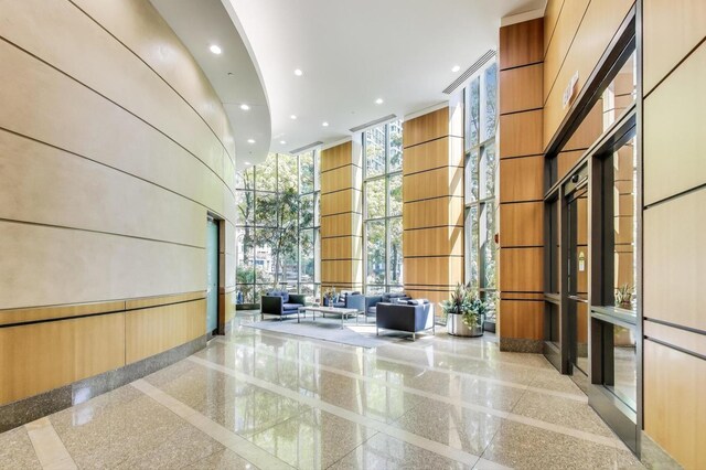 400 N La Salle Dr Unit 1607, Chicago, IL 60654 - community lobby with a towering ceiling, a wall of windows, and recessed lighting