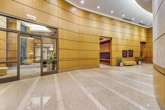 400 N La Salle Dr Unit 1607, Chicago, IL 60654 - community lobby featuring a towering ceiling, crown molding, recessed lighting, and wood walls