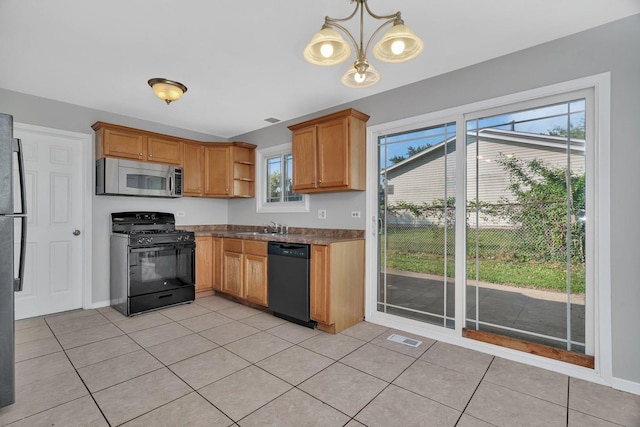 3701 176th St, Country Club Hills, IL 60478 - kitchen featuring black appliances, open shelves, dark countertops, and light tile patterned floors