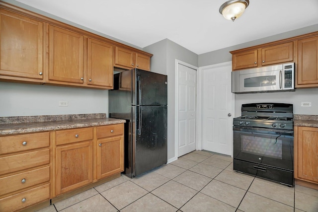 3701 176th St, Country Club Hills, IL 60478 - kitchen with black appliances, light tile patterned floors, and brown cabinets