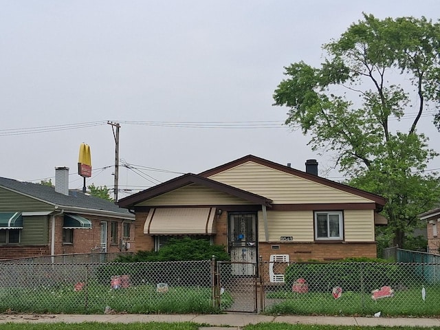 9543 S Green St, Chicago, IL 60643 - tri-level home with a fenced front yard, a gate, and brick siding