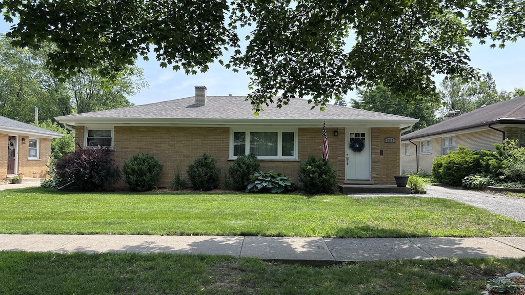 1317 N Mitchell Ave, Arlington Heights, IL 60004 - view of front of property with a front lawn, a chimney, and brick siding