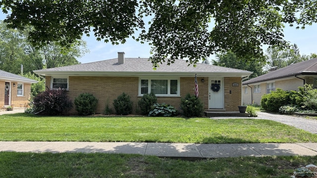 1317 N Mitchell Ave, Arlington Heights, IL 60004 - view of front of property with a front lawn, a chimney, and brick siding