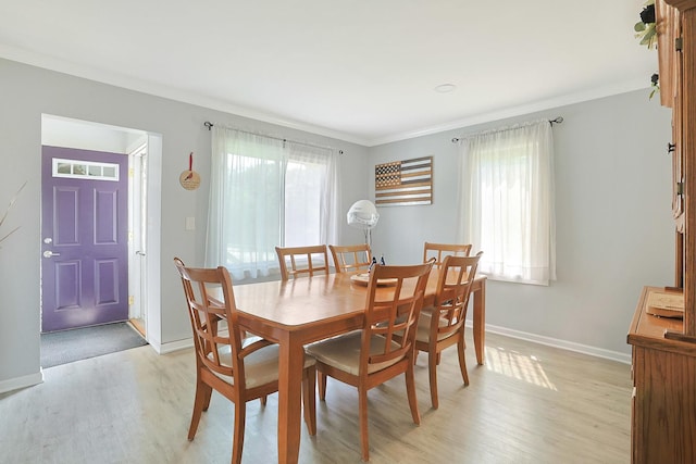 1452 Raymond St, South Elgin, IL 60177 - dining area with light wood-style flooring and ornamental molding