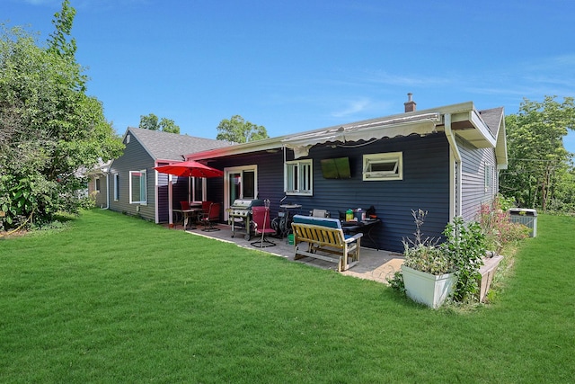 1452 Raymond St, South Elgin, IL 60177 - rear view of house with a patio area and a lawn