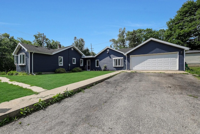 1452 Raymond St, South Elgin, IL 60177 - ranch-style house featuring a front yard, asphalt driveway, and an attached garage