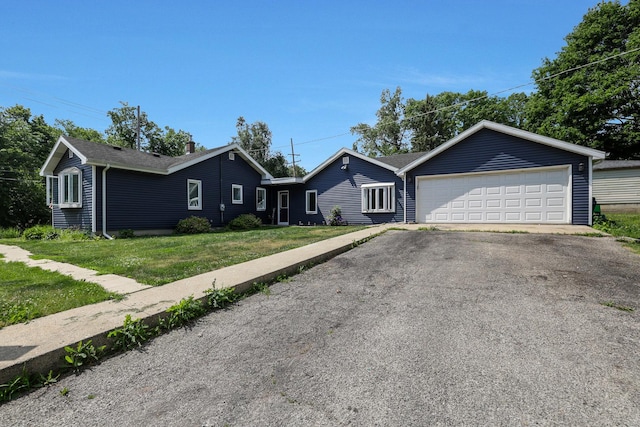1452 Raymond St, South Elgin, IL 60177 - ranch-style house with a front lawn, driveway, and an attached garage
