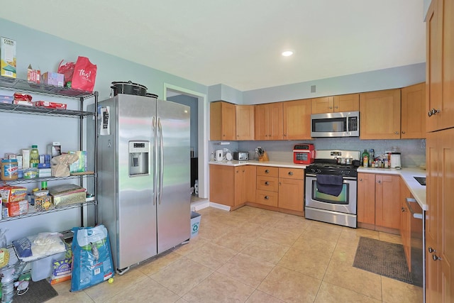 1452 Raymond St, South Elgin, IL 60177 - kitchen featuring stainless steel appliances, light countertops, light tile patterned floors, recessed lighting, and tasteful backsplash