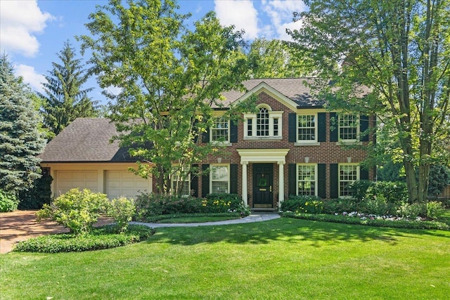 1300 Hackberry Ln, Winnetka, IL 60093 - colonial home with a garage, a front lawn, brick siding, and driveway