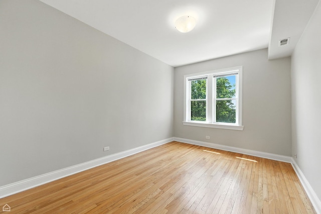 3302 W Crystal St Unit 3, Chicago, IL 60651 - empty room with light wood-style flooring and baseboards