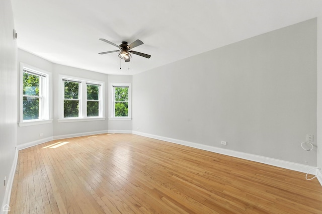 3302 W Crystal St Unit 3, Chicago, IL 60651 - empty room featuring ceiling fan, light wood-type flooring, and healthy amount of natural light