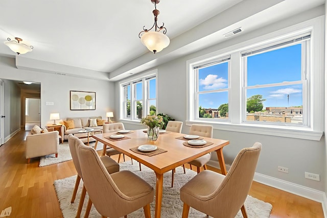 3302 W Crystal St Unit 3, Chicago, IL 60651 - dining area featuring light wood finished floors and a raised ceiling