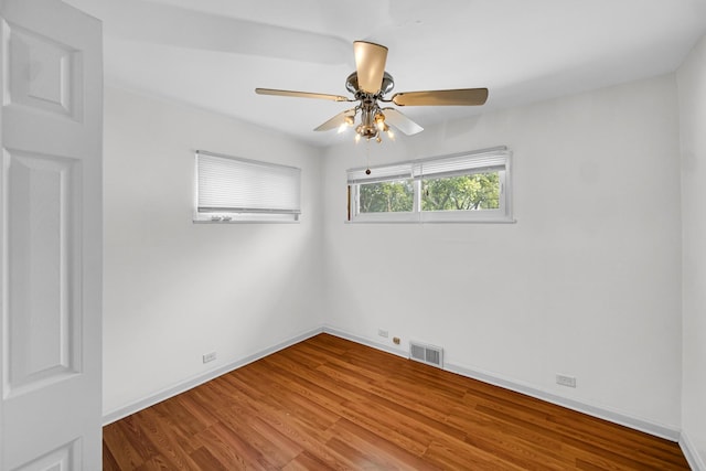14627 State St, Dolton, IL 60419 - spare room featuring ceiling fan and wood finished floors