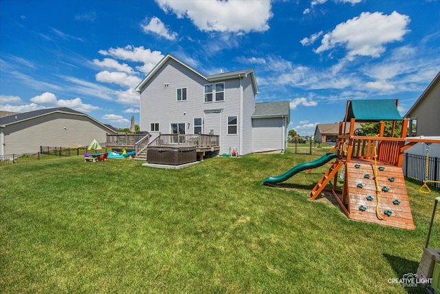 808 Karen Dr, Hampshire, IL 60140 - back of property featuring a playground and a wooden deck