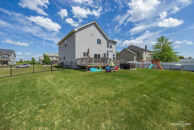 808 Karen Dr, Hampshire, IL 60140 - rear view of house with a playground, a fenced backyard, and a wooden deck