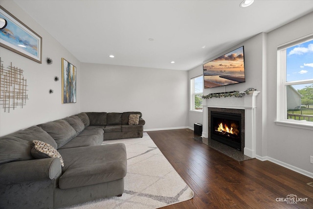 808 Karen Dr, Hampshire, IL 60140 - living area featuring healthy amount of natural light, a fireplace with flush hearth, dark wood-style flooring, and recessed lighting