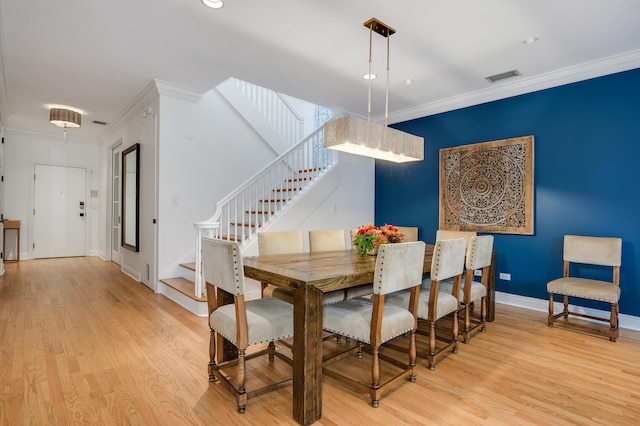824 W Armitage Ave Unit 2Cd, Chicago, IL 60614 - dining room with stairway, light wood-style flooring, crown molding, and recessed lighting