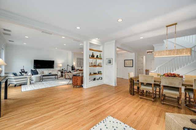 824 W Armitage Ave Unit 2Cd, Chicago, IL 60614 - living area featuring crown molding, light wood-style floors, stairs, and recessed lighting