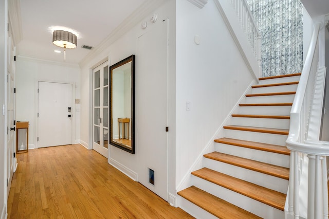 824 W Armitage Ave Unit 2Cd, Chicago, IL 60614 - entryway featuring stairs, light wood-style floors, and ornamental molding
