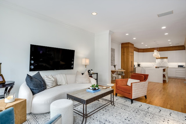 824 W Armitage Ave Unit 2Cd, Chicago, IL 60614 - living room featuring ornamental molding, recessed lighting, and light wood-style floors
