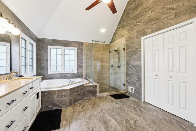 51 Mitchell Cir, Wheaton, IL 60189 - bathroom featuring lofted ceiling, marble tiled floors, a garden tub, vanity, and a stall shower