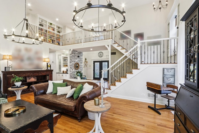 51 Mitchell Cir, Wheaton, IL 60189 - living area featuring a chandelier, a high ceiling, stairs, wood finished floors, and french doors