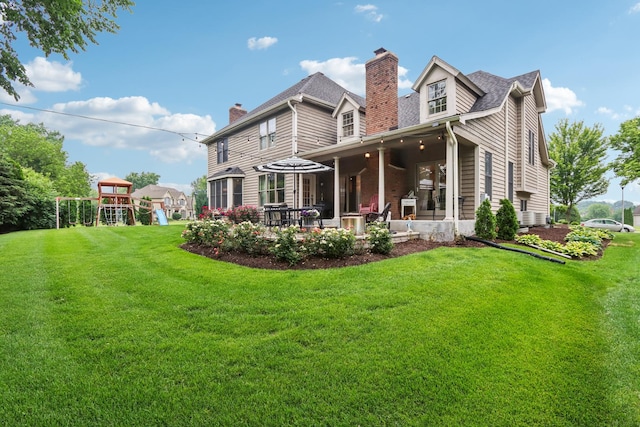 51 Mitchell Cir, Wheaton, IL 60189 - rear view of house with a chimney, a playground, a yard, and a patio area