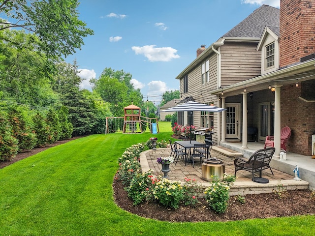 51 Mitchell Cir, Wheaton, IL 60189 - view of green lawn with a patio and a playground