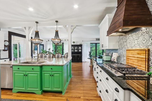 51 Mitchell Cir, Wheaton, IL 60189 - kitchen featuring custom range hood, stainless steel appliances, white cabinetry, light wood finished floors, and tasteful backsplash