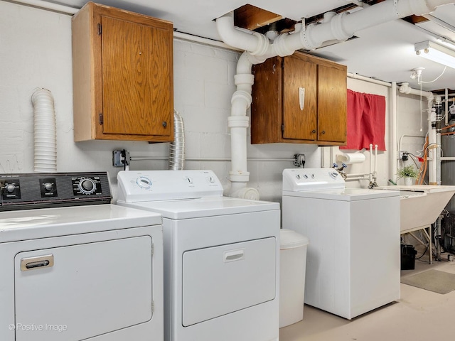 4220 Maple Ave, Brookfield, IL 60513 - laundry room with washer and dryer, cabinet space, and concrete block wall