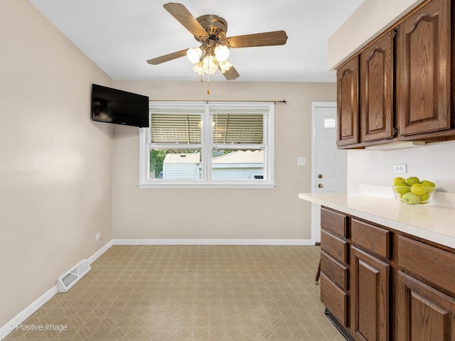 4220 Maple Ave, Brookfield, IL 60513 - kitchen with light floors, a ceiling fan, and light countertops