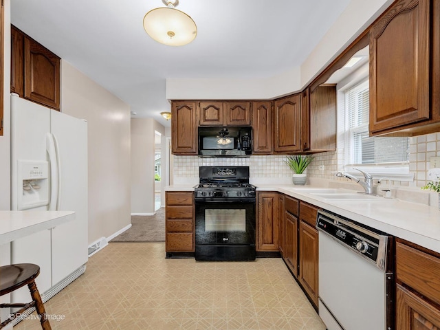 4220 Maple Ave, Brookfield, IL 60513 - kitchen featuring black appliances, light floors, tasteful backsplash, and light countertops