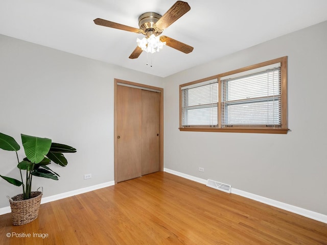 4220 Maple Ave, Brookfield, IL 60513 - unfurnished bedroom with light wood-style flooring, a closet, and ceiling fan