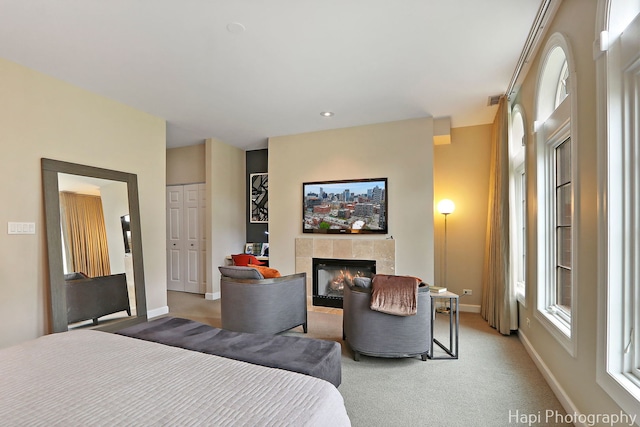 358 W Huron St Unit B, Chicago, IL 60654 - bedroom featuring a tile fireplace and light carpet